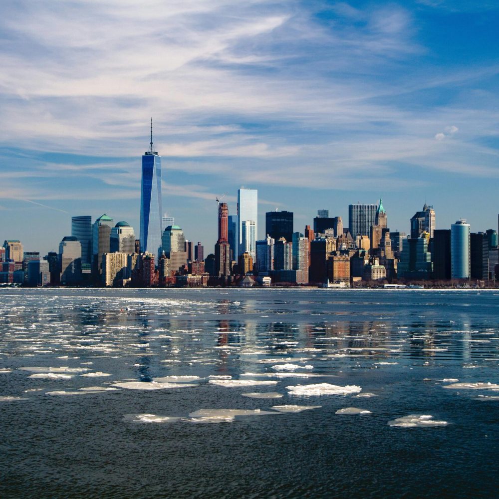 new york skyline new york city city 37646 37646 A stunning winter morning captures New York City skyline with icy waters in the foreground.